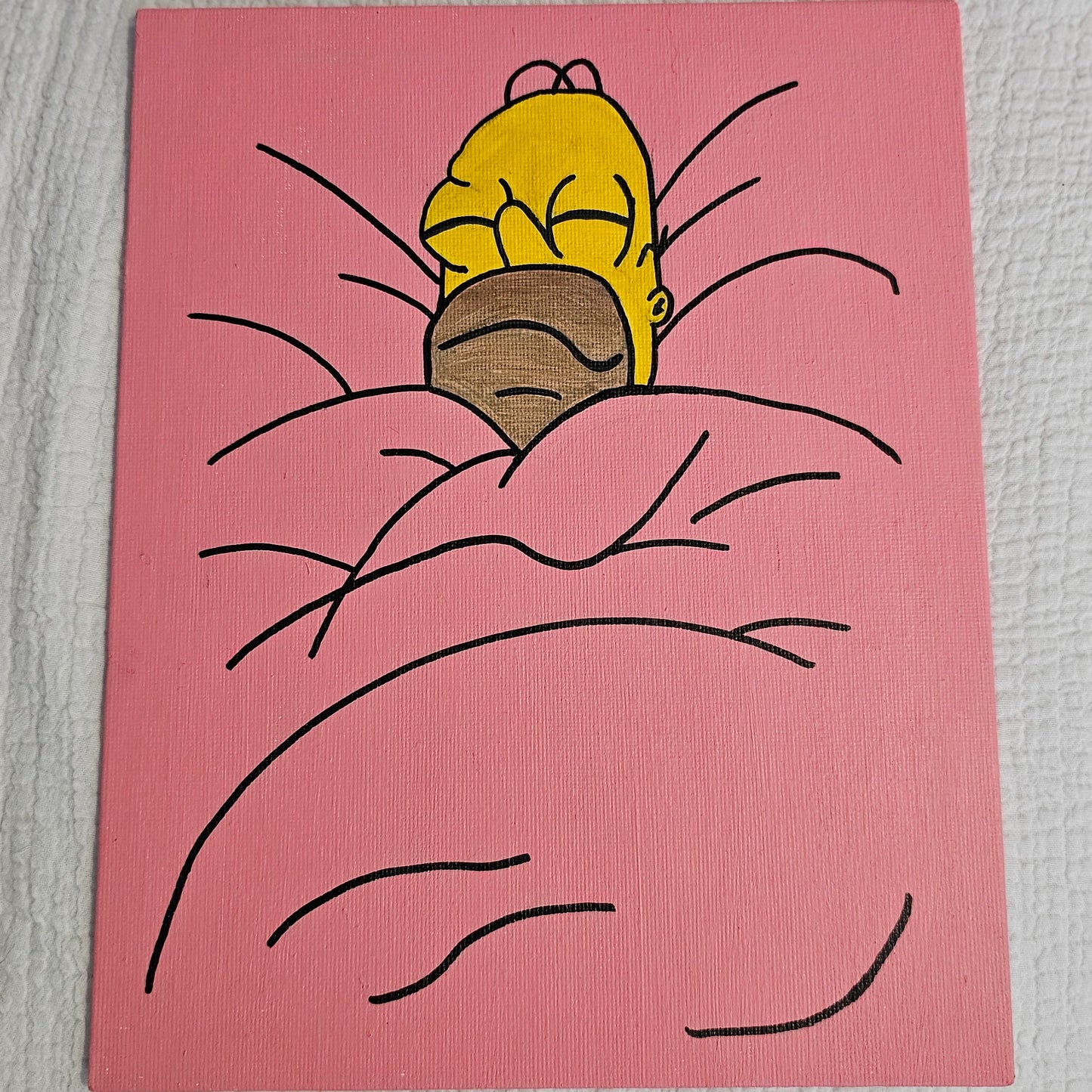 A very yellow bald man with beard scruff (Homer Simpson), sleeps comfortably bundled in a pink blanket that makes up the entirety of the canvas